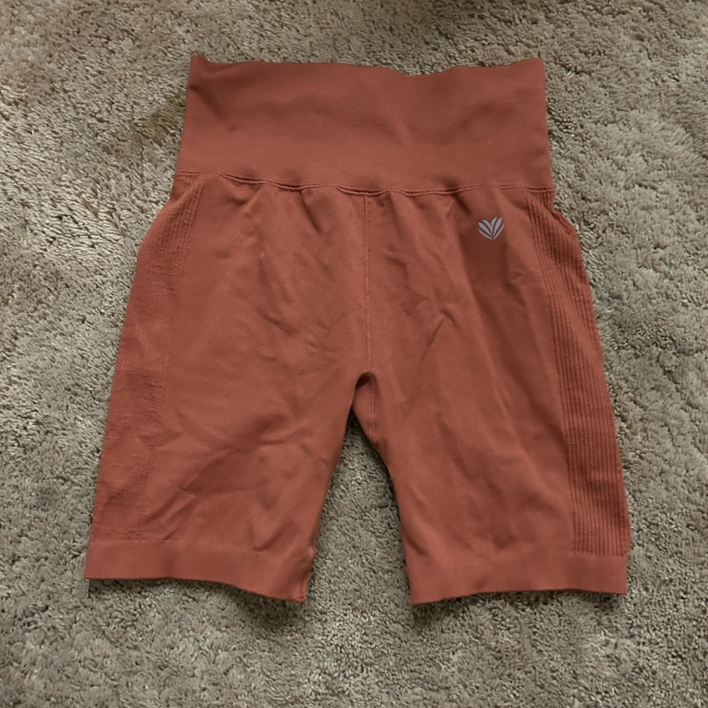 Orange biker shorts perfect for exercising and other activities
